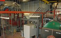The fuel store and biomass boiler in the plant room