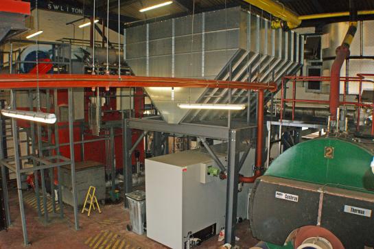 The fuel store and biomass boiler in the plant room
